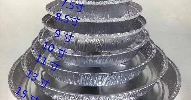 Round aluminum foil pans stacked by size